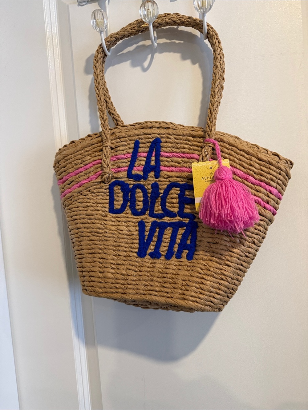 Straw Tote Bag with Pink Tassel and Blue 'LA DOLCE VITA' Script
